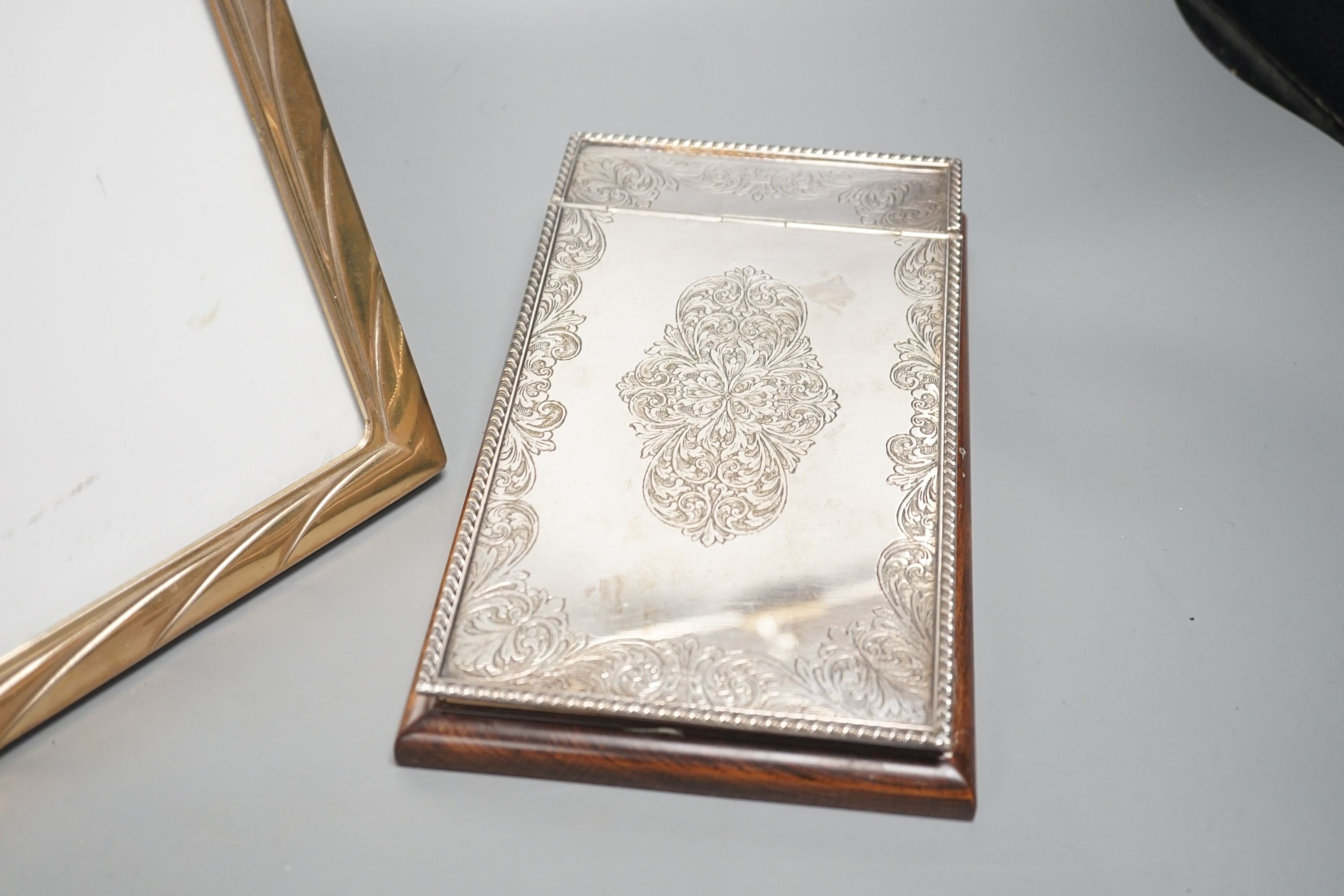 A ‘925’ frame and an electroplate mounted desk notepad, 24cm